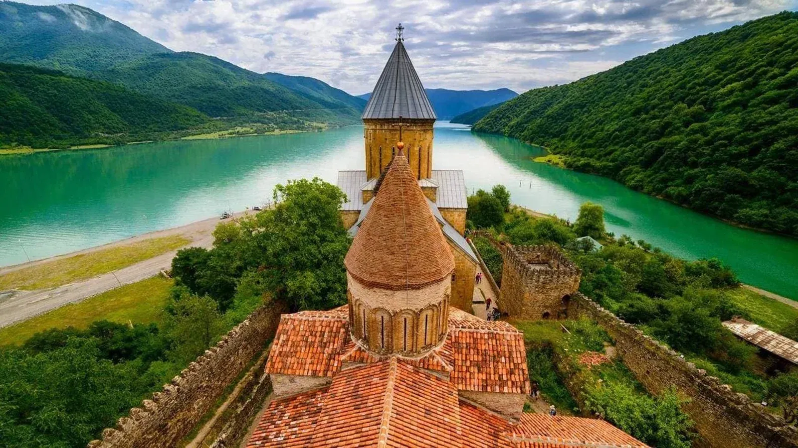 Ananuri monastery beside a turquoise lake in Georgia