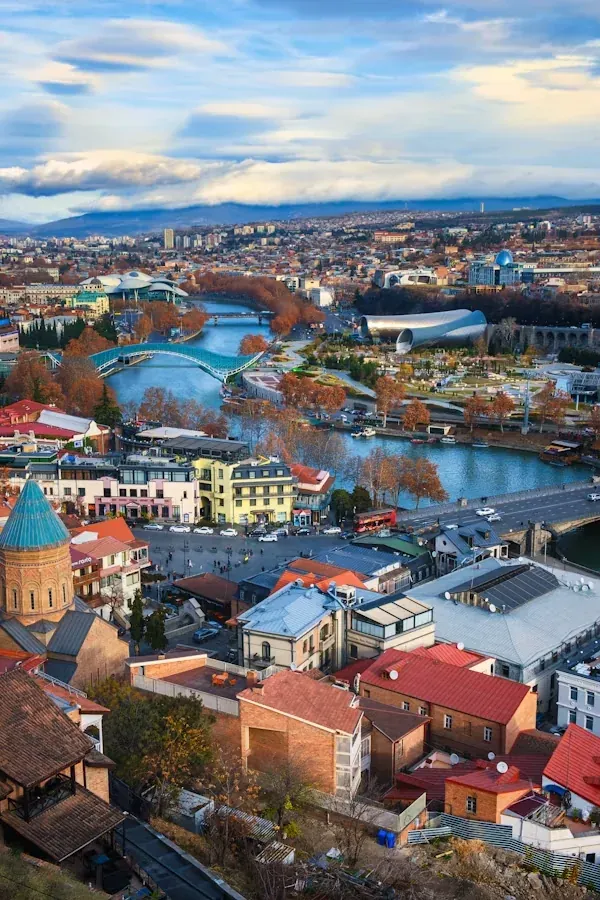 Panoramic view of Tbilisi, the Mtkvari River, and the city skyline